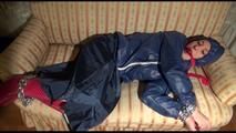 Mara tied, gagged and hooded on an old sofa wearing a cool blue rain skirt and a jacket as well as rubber boots (Video)