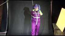 MARA tied and gagged overhead with ropes and a cloth gag wearing a super sexy super shiny purple rainsuit and blue rubber boots (Video)