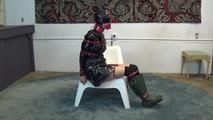 Ana in shiny raincoat bondage
