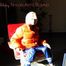 Pia tied and gagged on a chair wearing a shiny orange down jacket and a shiny blue rain pants (Pics)
