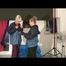 Jenny and Yvonne having a good time together wearing sexy shiny nylon rainwear (Video)