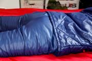 Pia hooded, tied and gagged on bed in a dark blue old school down ski suit