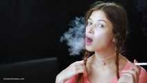 Watch the beauty with crystal blue eyes smoking a 120mm cigarette in her fresh video