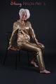 Blonde archive girl posing in a studio wearing a sexy golden rainwear combination (Pics)
