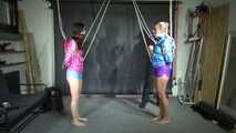 Aiyana and Ms Ungeniert in shiny nylon Shorts and Windbreaker tied and gagged together