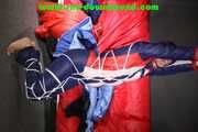 Sexy Sonja wearing a sexy oldschool shiny nylon downbib and donjacket being tied and gagged with ropes overhead (Pics)