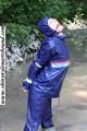 Stella bound outdoor in a blue rainsuit