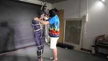 Myxxxy bound and gagged in a shiny nylon Rainsuit