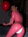 A babypink latex catsuit with Emma and a wet diaper inside