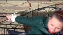 Mara tied and gagged on a princess bed in an old cellar wearing an supersexy shiny green down jacket and a rain pants (Video)