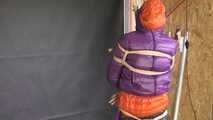 Rachel Adams bound, gagged and double hooded in shiny downjackets