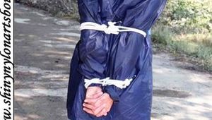 Stella bound outdoor in a blue rainsuit