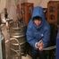 Archive girl tied, gagged and hooded in a cellar wearing a shiny light blue downcoat (Video)