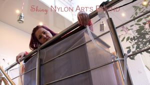 Mara tied and gagged bending over an commode wearing shiny nylon rainwear (Pics)