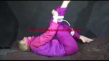 PIA tied and gagged with ropes and cloth gag on a sofa wearing an sexy oldschool purple/pink skisuit (Video)