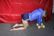 Watching sexy Sonja wearing a supersexy oldschool blue shiny nylon shorts and a lightblue rain jacket during her workout with barbells (Pics)