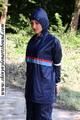 Stella bound outdoor in a blue rainsuit