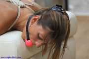 Hogtied on a white seater