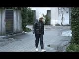 Blonde-haired archive girl going out wearing shiny nylon rainwear (Video)
