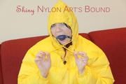 Jill ties, gagges and hoodes herself wearing a shiny yellow down jacket and a yellow rain pants(Pics)
