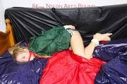Samantha tied and gagged in bed wearing a black shiny nylon shorts and a green rainjacket (Pics)