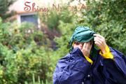 Jill Diamond in the garden playing with water out of the garden hose wearing supersexy shiny nylon rainwear and a rain cape (Pics)