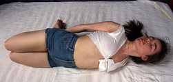Doris hogtied on bed