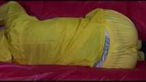 Watching Mara putting on sexy yellow shiny nylon rainwear lolling on the sofa (Video)