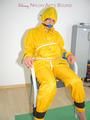 Katharina tied, gagged and hooded on a chair wearing sexy yellow rainwear (Pics)
