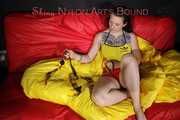 SEXY MARA ties and gagges herself with cuffs and a ball gag wearing a sexy red/yellow shiny nylon shorts and a sexy yellow top (Pics)