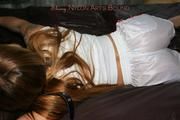 Katharina tied and gagged in shiny nylon shorts