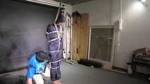 Myxxxy bound and gagged in a shiny nylon Rainsuit