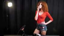 Skinny girl with wild red hair loves smoking a 120mm between the shooting