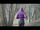 Alina wearing a jeans over a sexy shiny nylon shorts and a purple down jacket strolling on a lake (Video)