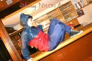 Jill posing in a bar wearing ONLY a sexy rainwear combination (Pics)