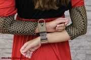 Damsel Sophia cuffed with special rigid cuffs
