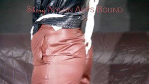 ***HOT SANDRA*** tied and gagged with ropes and a cloth gag overhead wearing a brown rain pant and a black rian jacket (Pics)