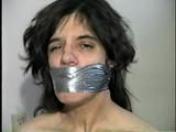 26 Yr OLD K-MART CLERK WRAP TAPE GAGGED WEARING BATHING CAP, MOUTH STUFFED. TIT TIED, CROTCH ROPED, NUDE, GARTER BELT & NYLON STOCKINGS TIGHTLY TIED TO A CHAIR (D63-13)