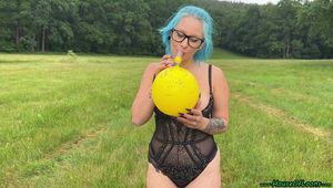 outdoor Blow2Pop topless yellow Q16 manga print with mouthpiece during rain 