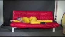 Watching Mara putting on sexy yellow shiny nylon rainwear lolling on the sofa (Video)