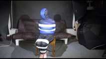 Watching SEXY MARA sitting on a chair being tied and gagged with tape and a clothgag and hood her the other way round (Video)