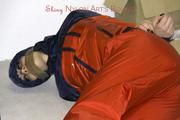 Shelly tied and gagged in shiny nylon rainwear
