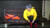 Watching Mara putting on a down jacket, rubber boots and a lifevest (Video)
