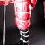 Mara wearing a sexy black shiny nylon down pants and a brandnew red special down jacket tied and gagged overhead with ropes (Pics)
