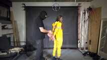 Marie tied and gagged in shiny nylon rainwear