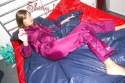 Alina preparing her bed for relaxing and lolling on the bed wearing a sexy shiny nylon rain pants and a rain jacket (Pics)
