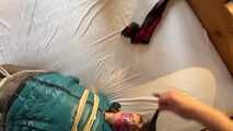 Rachel Adams tied and gagged in shiny Downwear