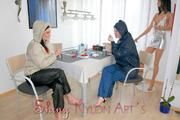 Jill and a friend of her enjoying a cup of coffee, smoking cigarettes at home while wearing supersexy blue and white rain- and downwear (Pics)