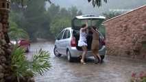 041004 Susana & Leticia Shelter In The Car To Pee Out The Rear Hatch.