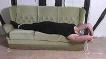 Aurora roped on couch 2/2